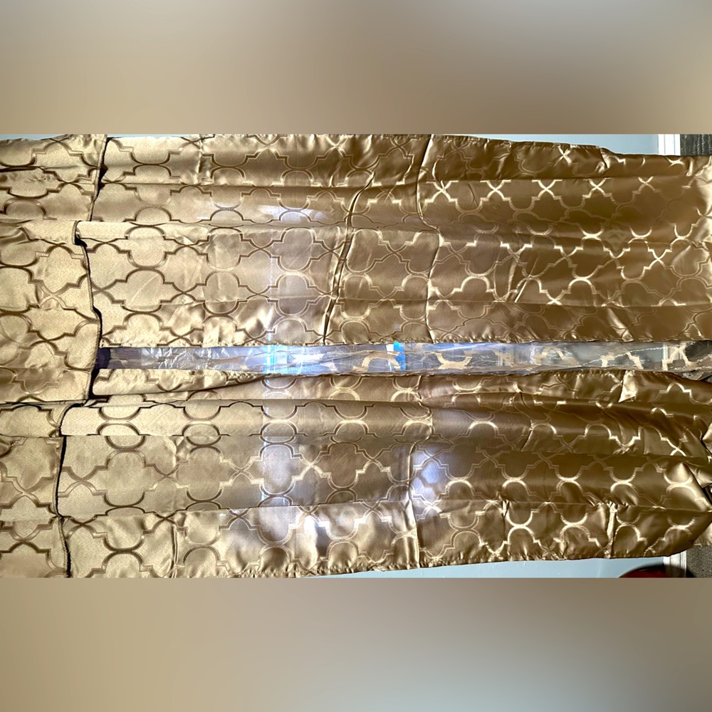 One 54x 84 luxury curtain panel. Includes 2 window tie backs. Never been used.